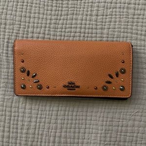 Coach wallet with rivets